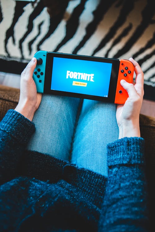 A Nintendo Switch and a Bunch of Super Mario Game Items · Free Stock Photo