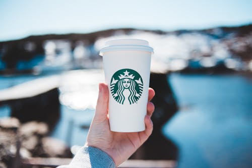 A Person Holding a Coffee Cup