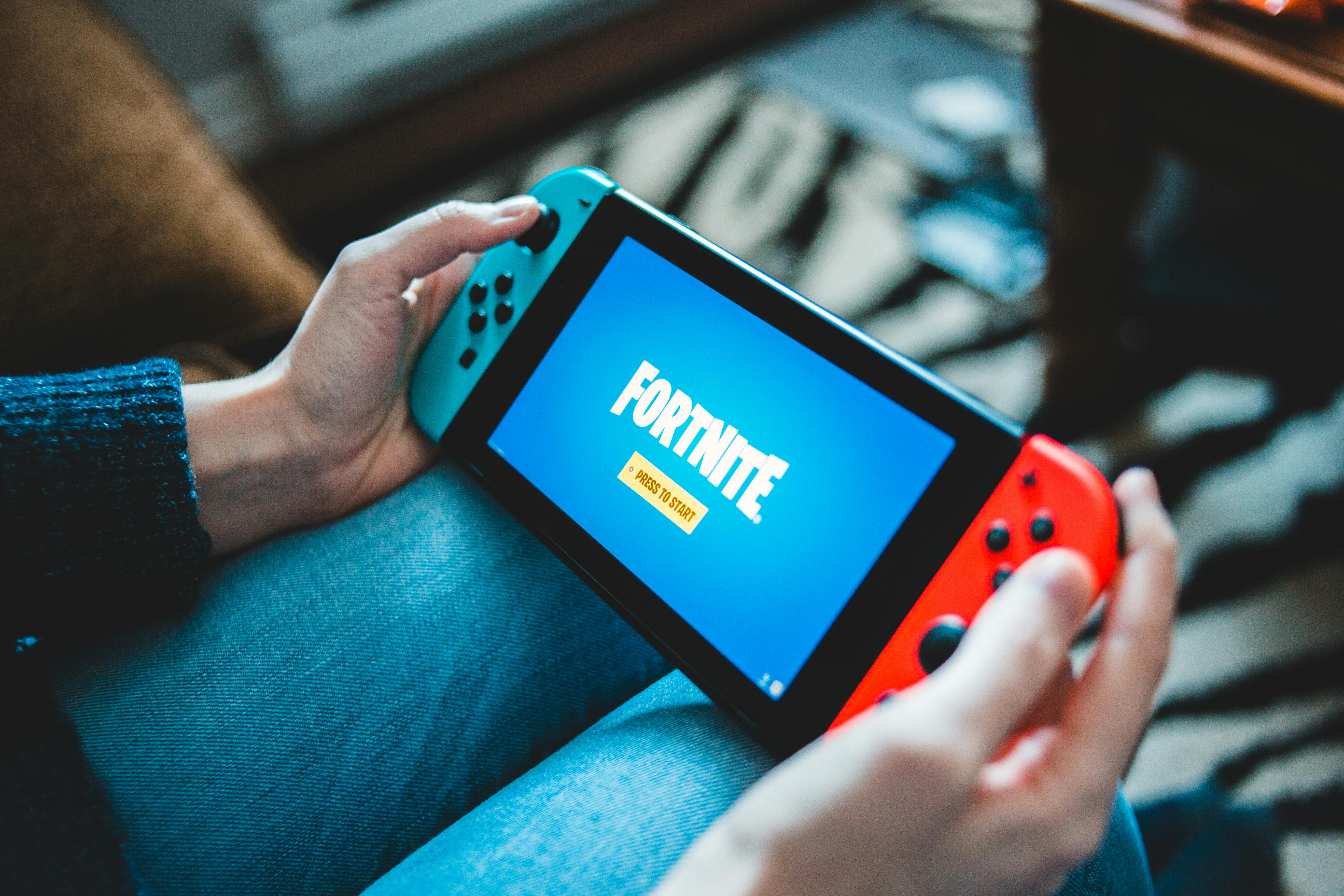 A Nintendo Switch and a Bunch of Super Mario Game Items · Free Stock Photo