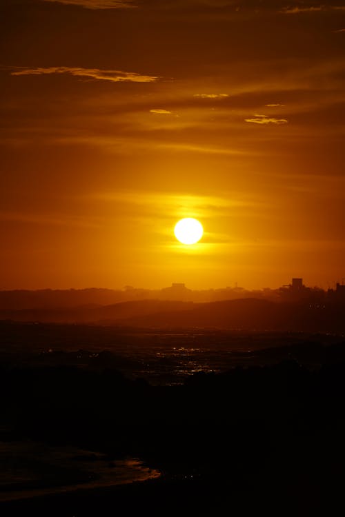 Ilmainen kuvapankkikuva tunnisteilla aallot, auringonlasku, hiekkaranta