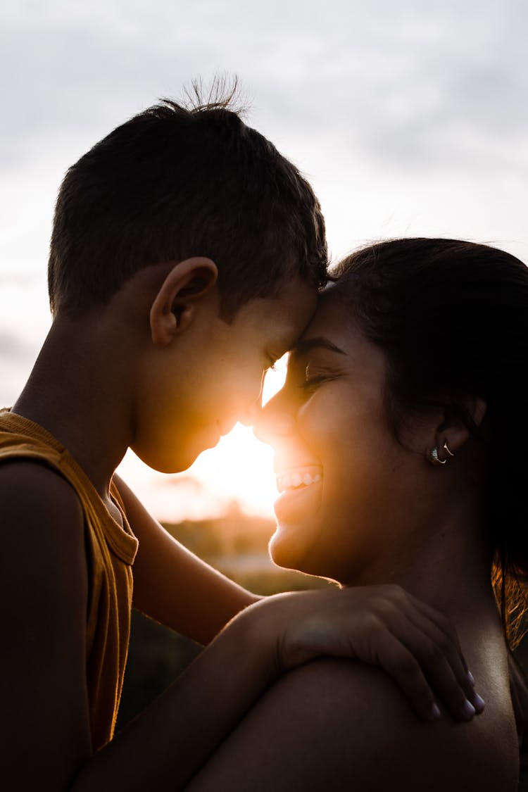 Photo Of A Mother And Son Nose To Nose