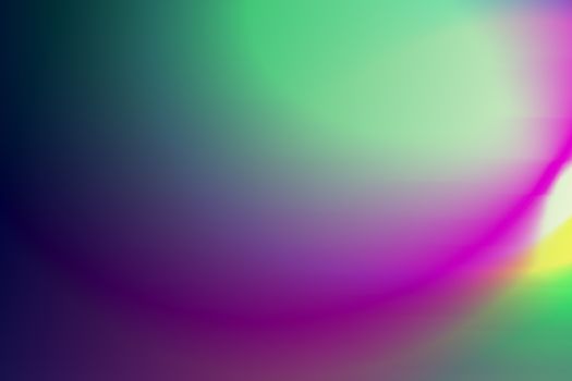 A mesmerizing abstract gradient featuring soft transitions of green, purple, and yellow hues.