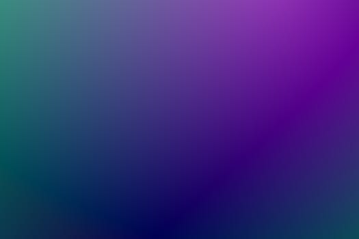 Abstract gradient background featuring a blend of purple and green hues, perfect for desktop wallpapers.