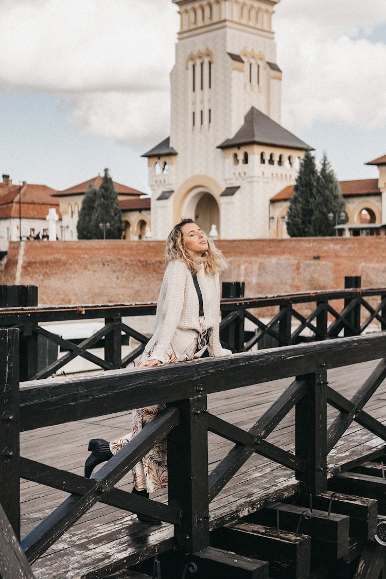 Charming Woman On Bridge Near Medieval Building