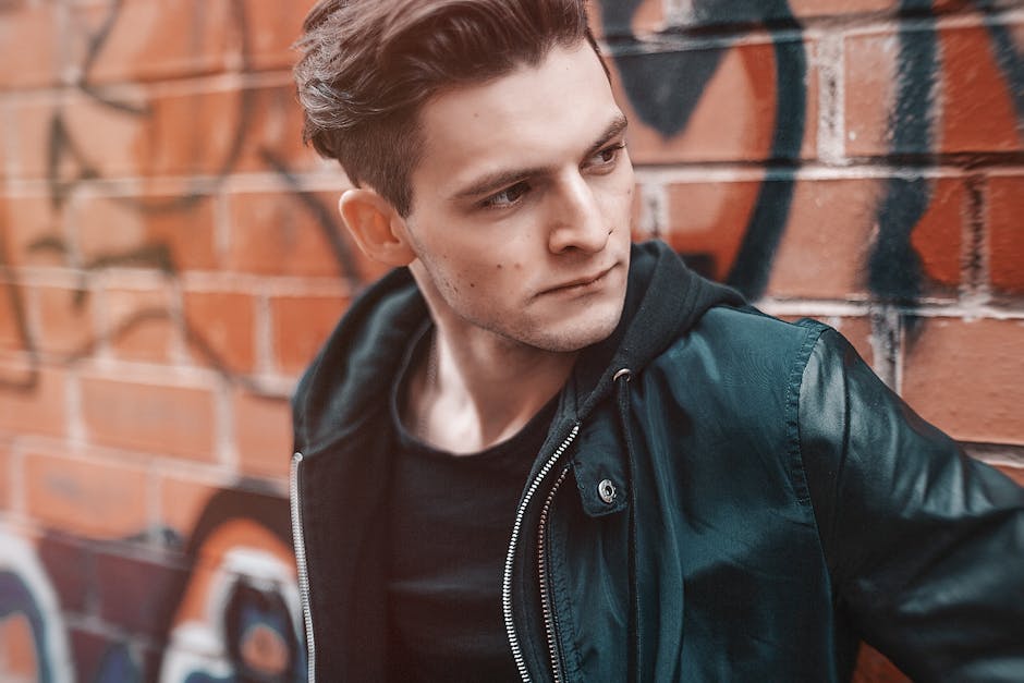 Close-up Photography of Man Wearing Leather Jacket