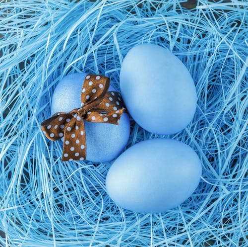 Painted eggs with bow on Easter Day