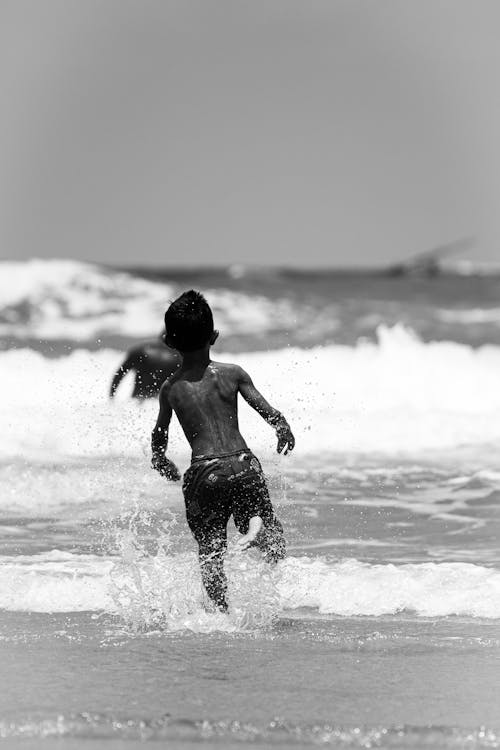 A Boy Running at the Beach · Free Stock Photo