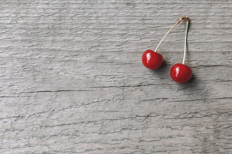 Delicious Ripe Red Cherries On Gray Background