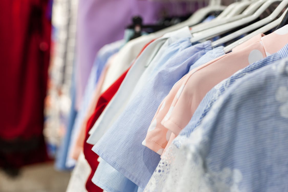 Collection of blouses on hangers in shop · Free Stock Photo