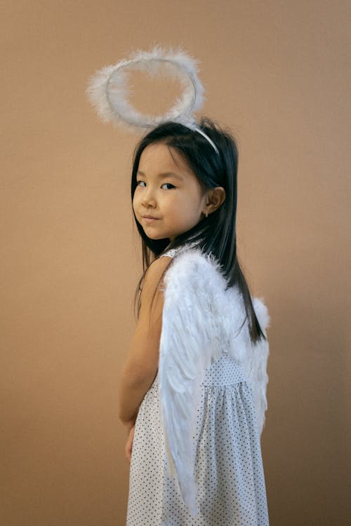 Cute Asian girl in angel costume