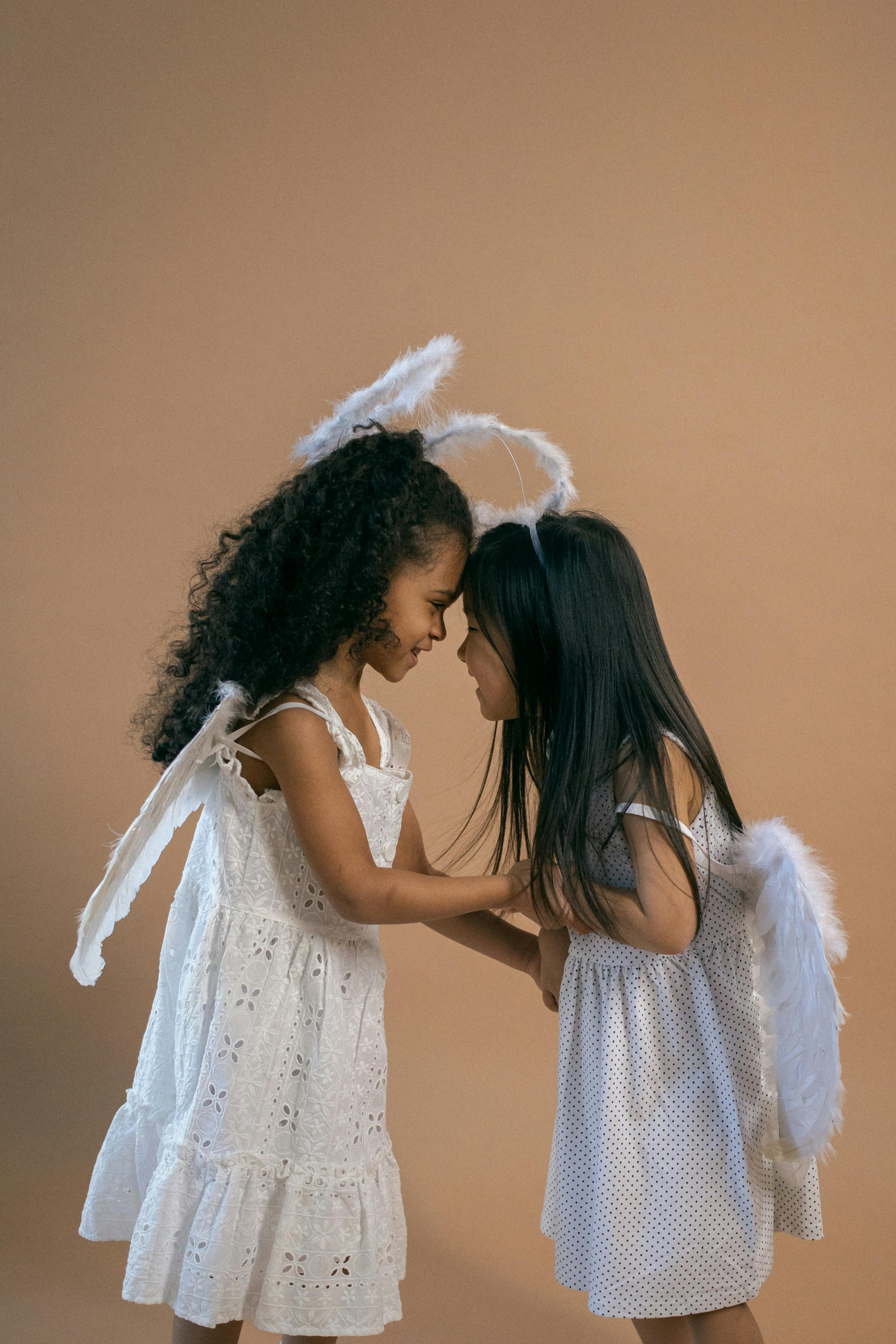 two little girls best friends holding hands