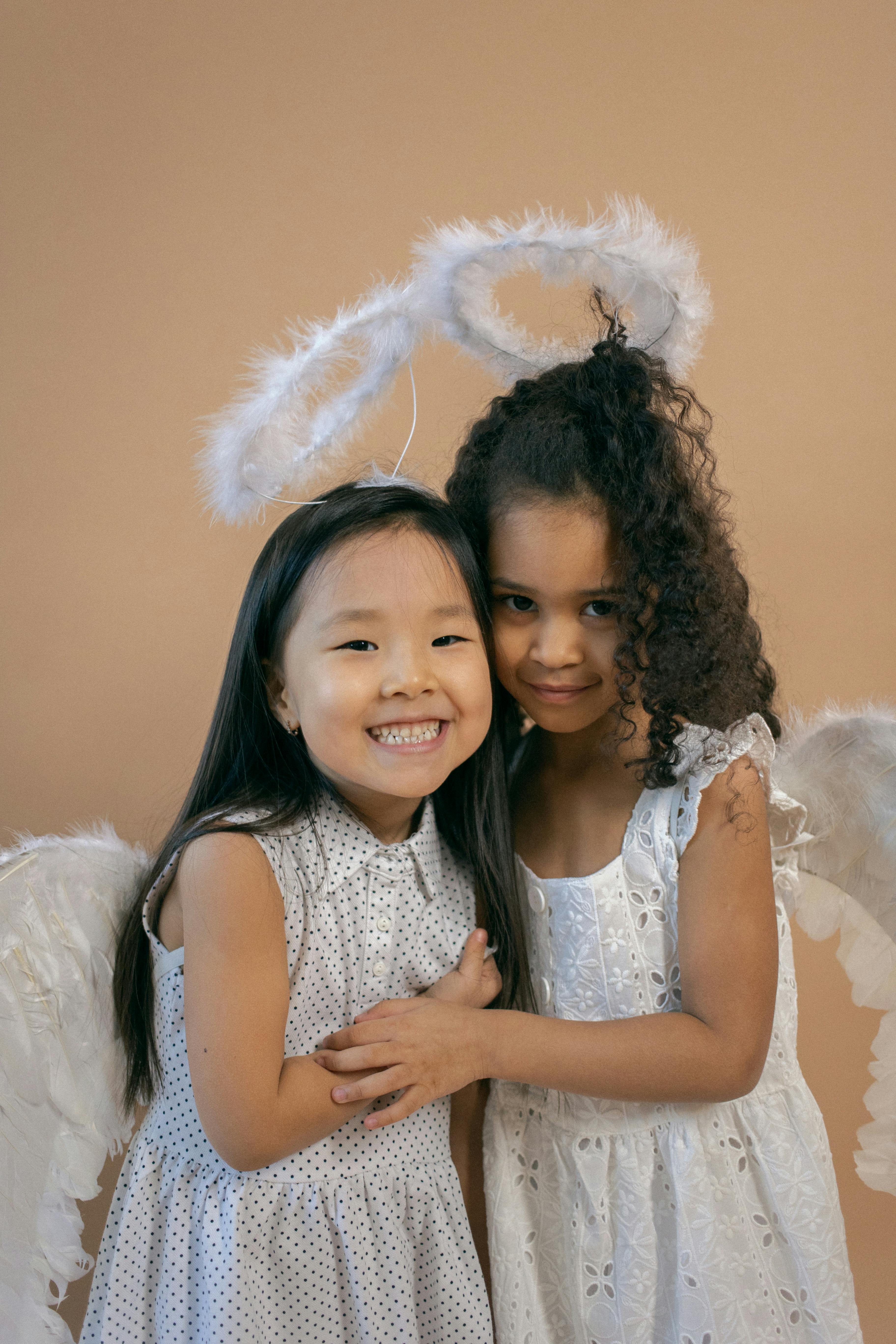 smiling asian girl standing near black friend