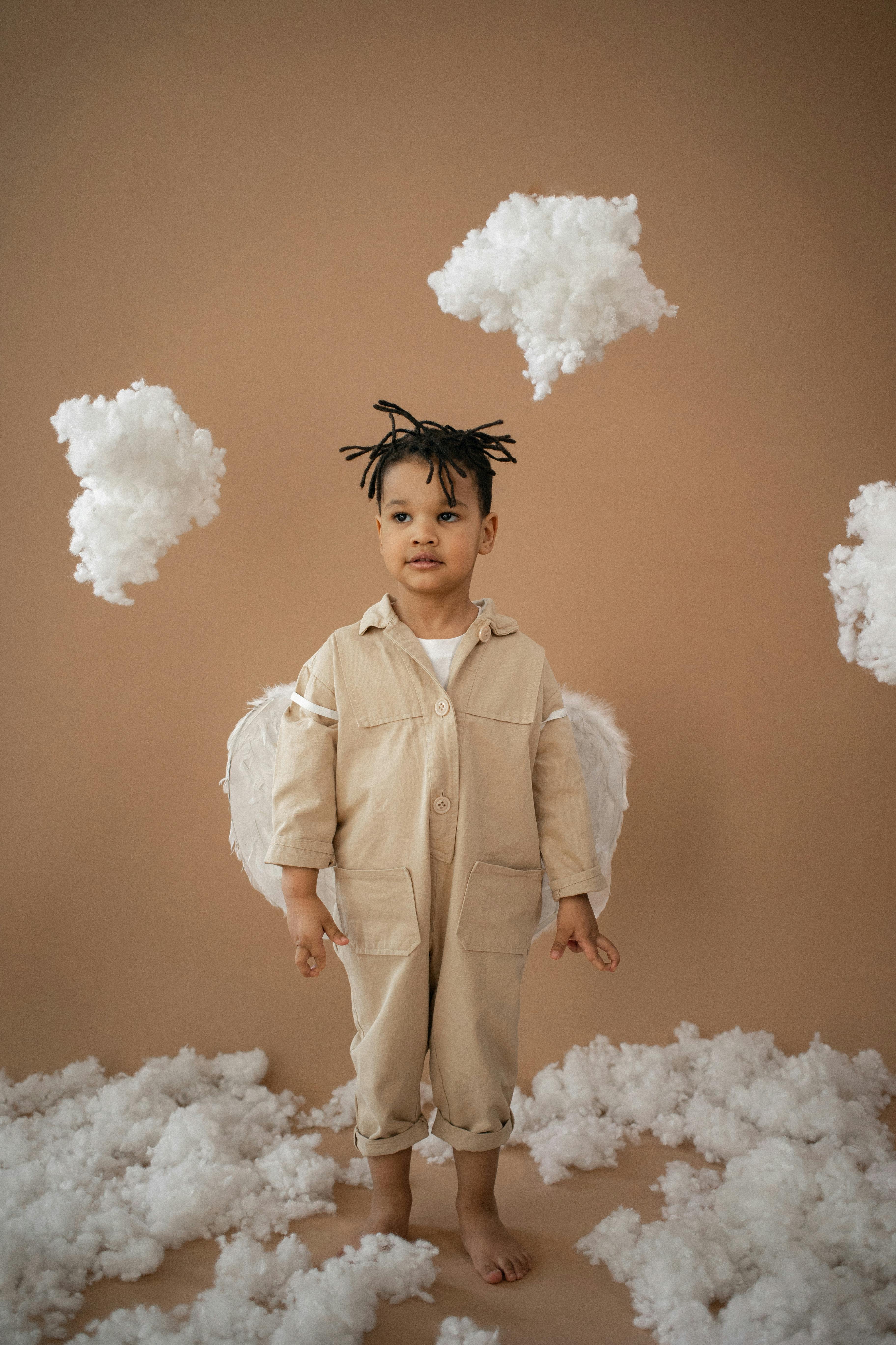 cute black boy in angel costume