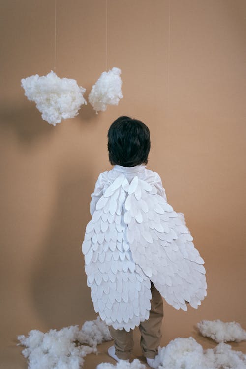 Anonymous boy in angel costume