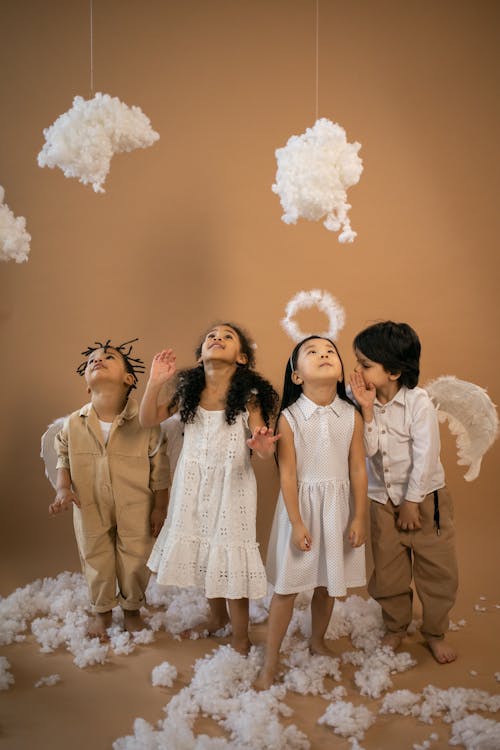 Diverse children in angel costumes