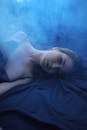 Asian model on crumpled fabric in smoke