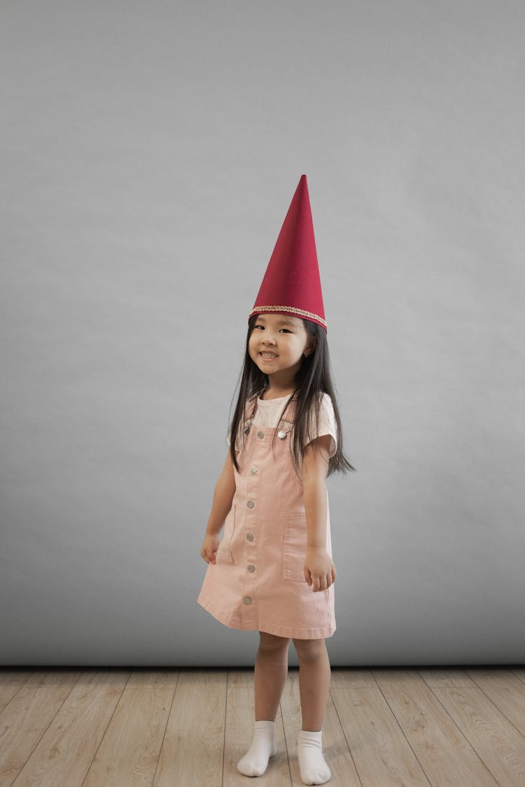 Happy Asian Girl In Gnome Cap