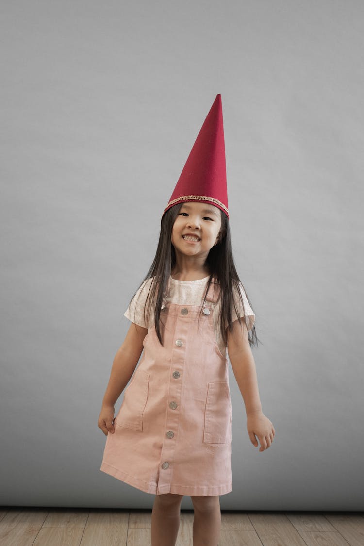 Joyful Asian Girl In Gnome Hat