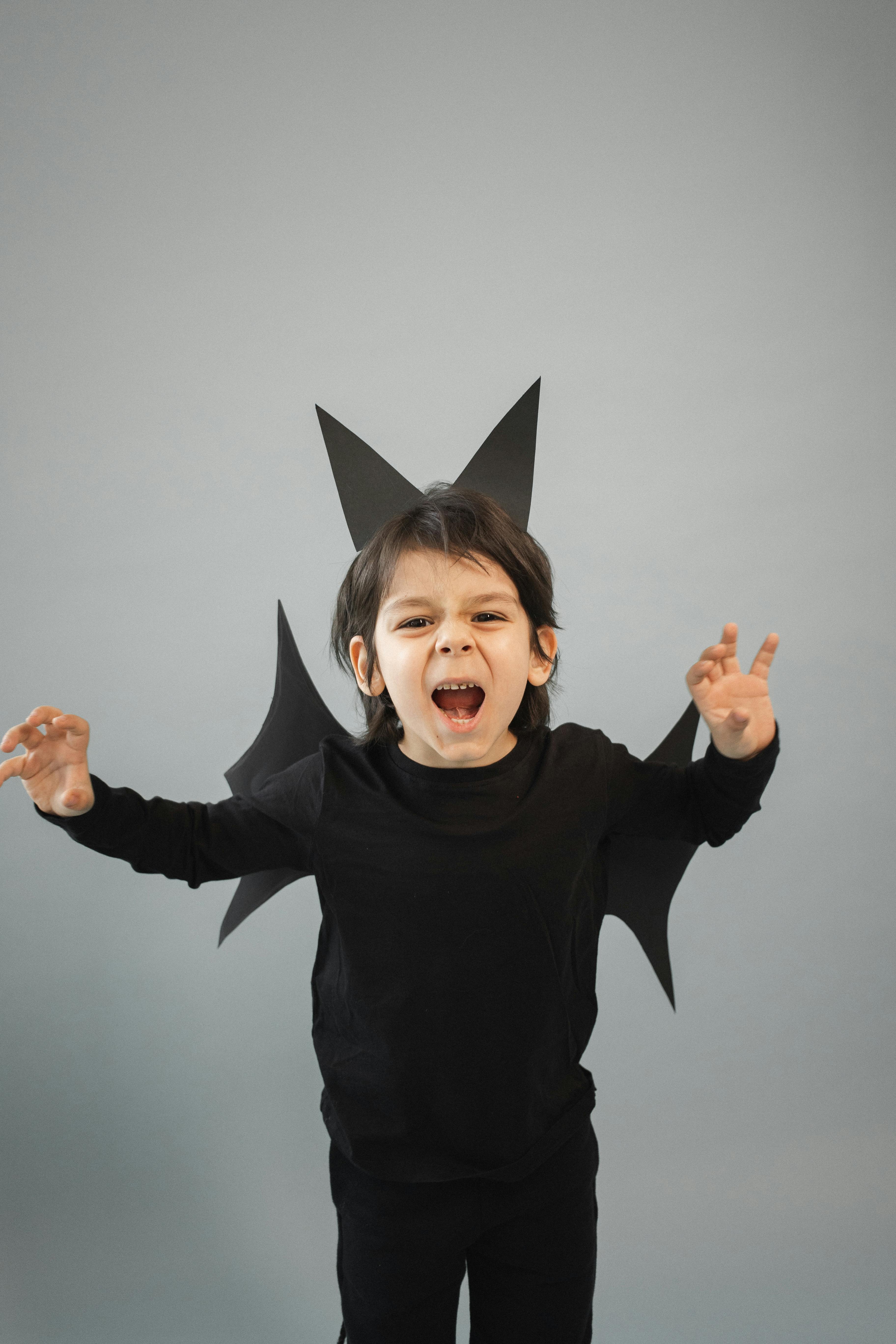 angry boy in bat costume