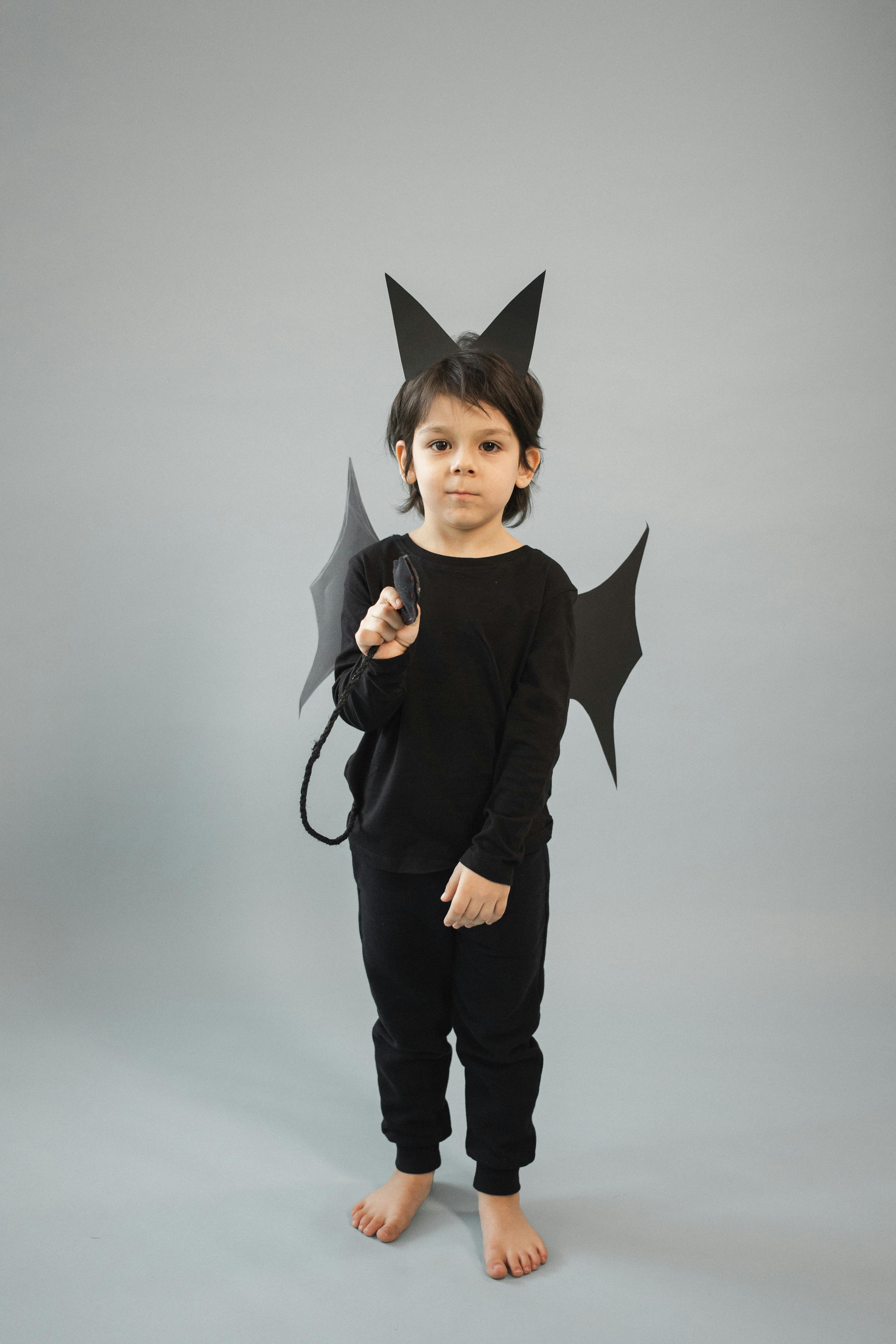 cute boy in black bat costume