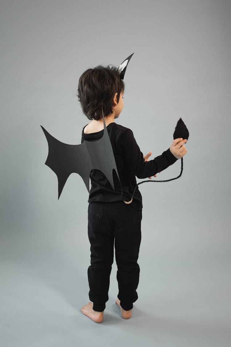 Anonymous Boy In Black Bat Outfit