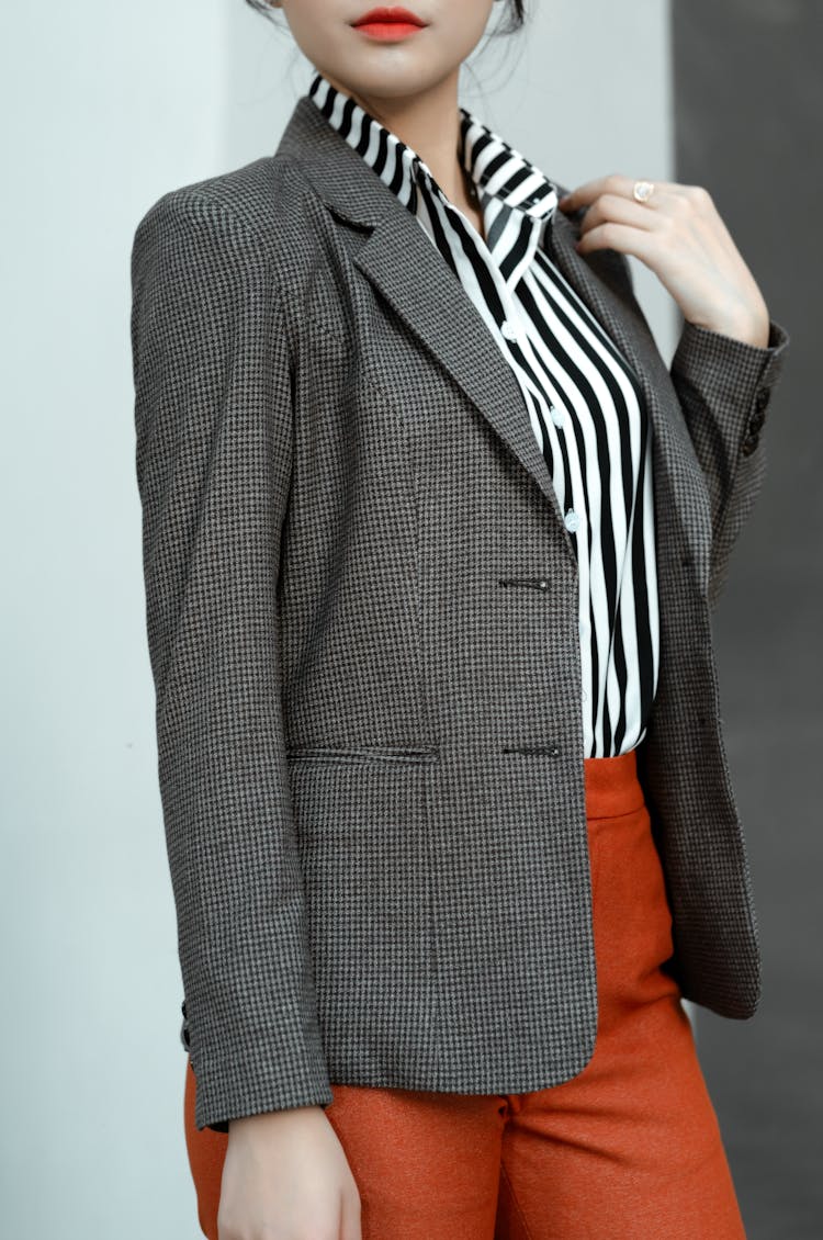 A Person In A Houndstooth Patterned Suit Jacket