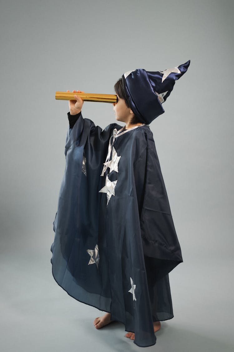 Boy In Astrologer Costume With Telescope