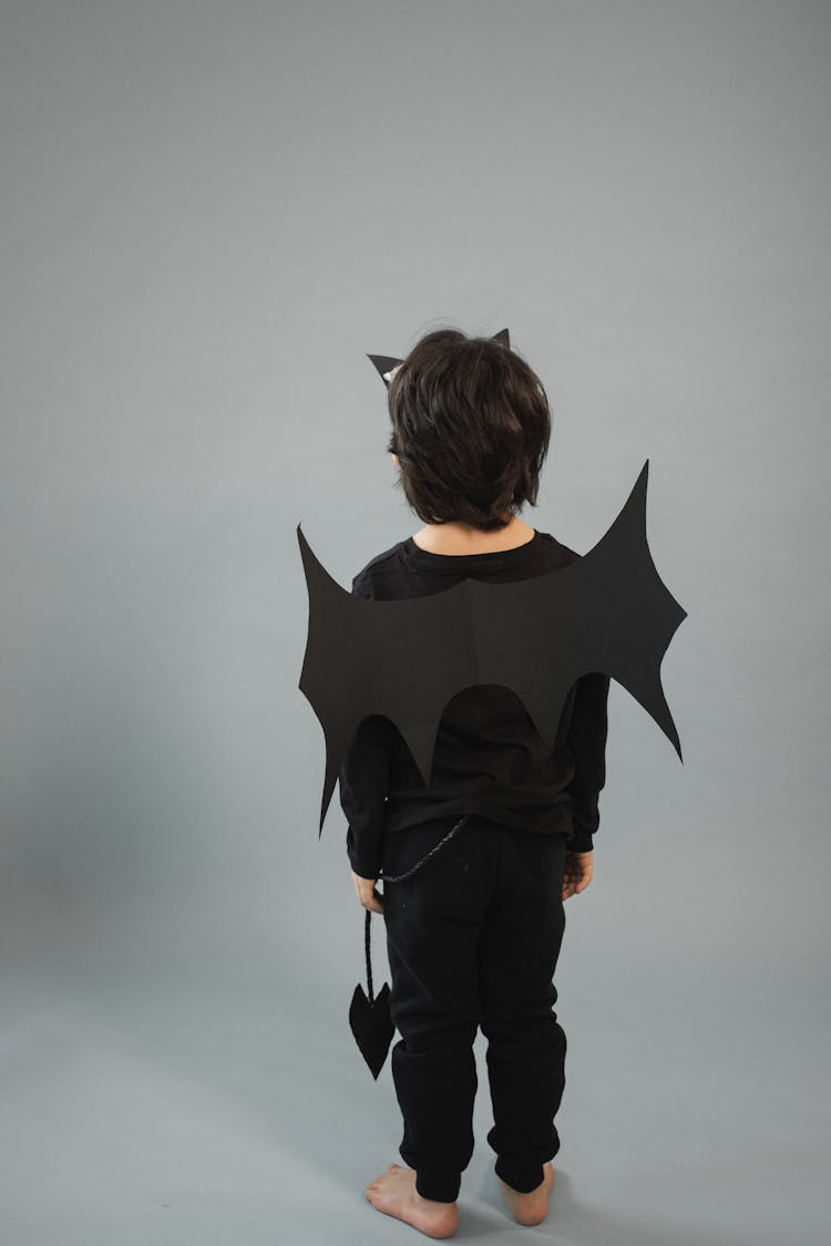 Faceless Boy In Bat Costume