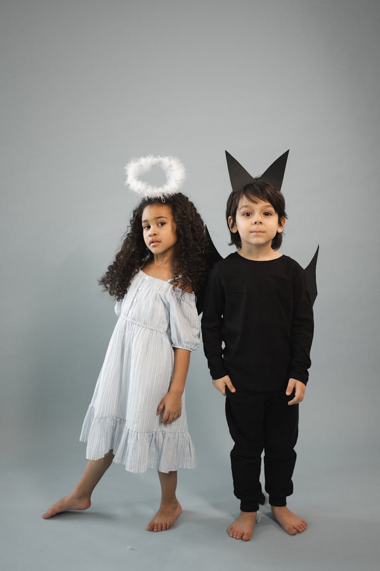 Cute Diverse Kids In Angel And Bat Costumes