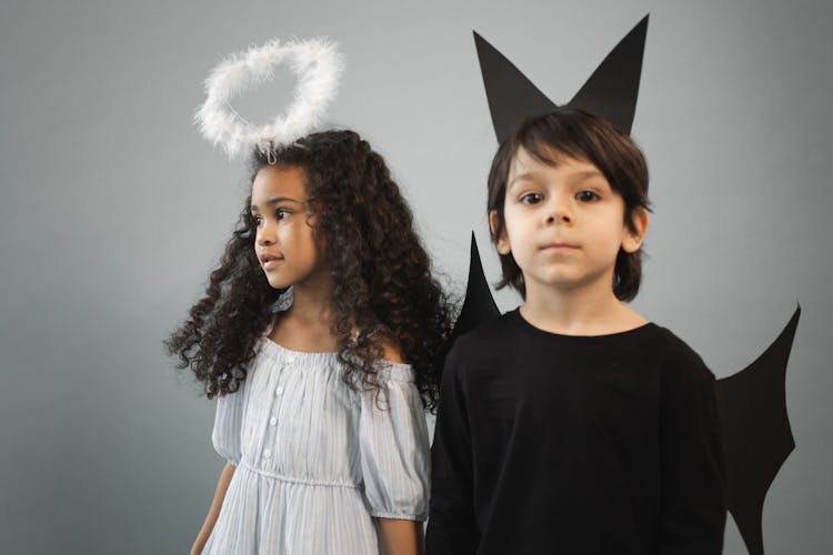 Multiracial Children In Angel And Bat Outfits