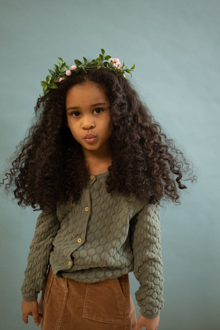 Black Girl In Wreath Pouting Lips In Studio