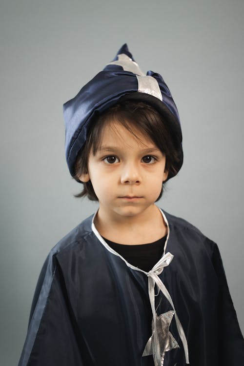 Free Cute boy dressed in magician costume Stock Photo