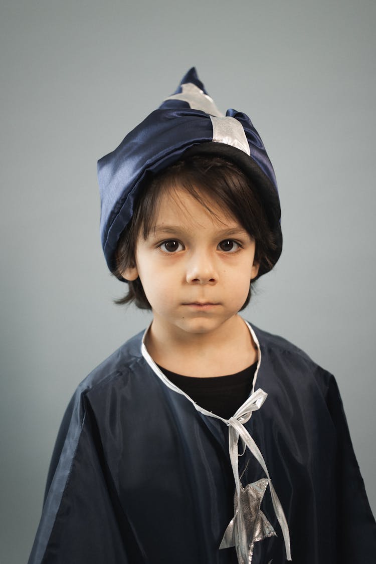 Cute Boy Dressed In Magician Costume