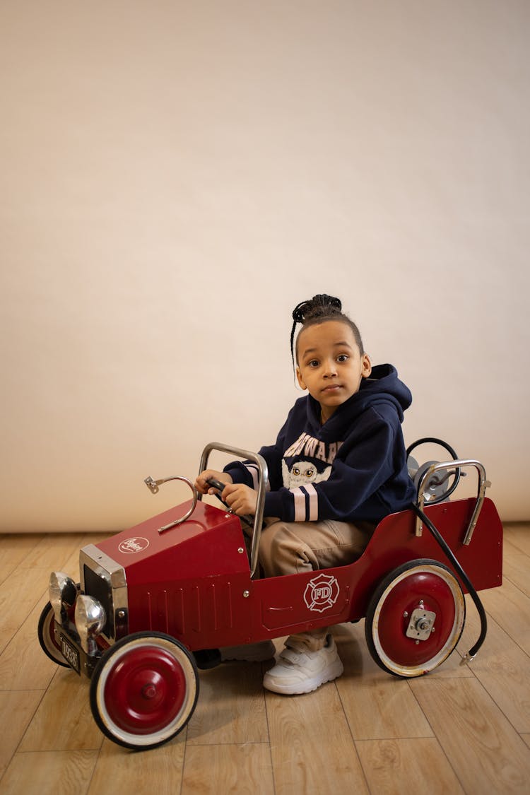 Black Boy With Eyes Wide Open In Velomobile