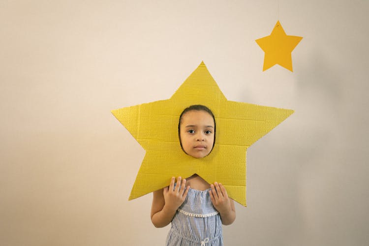 Cute Little Black Girl With Paper Star On Face