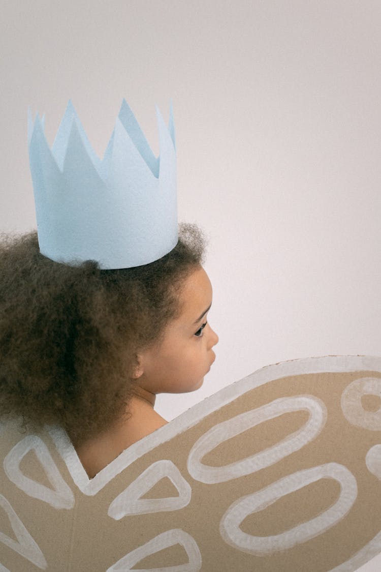 Little Girl In Paper Crown And Wings