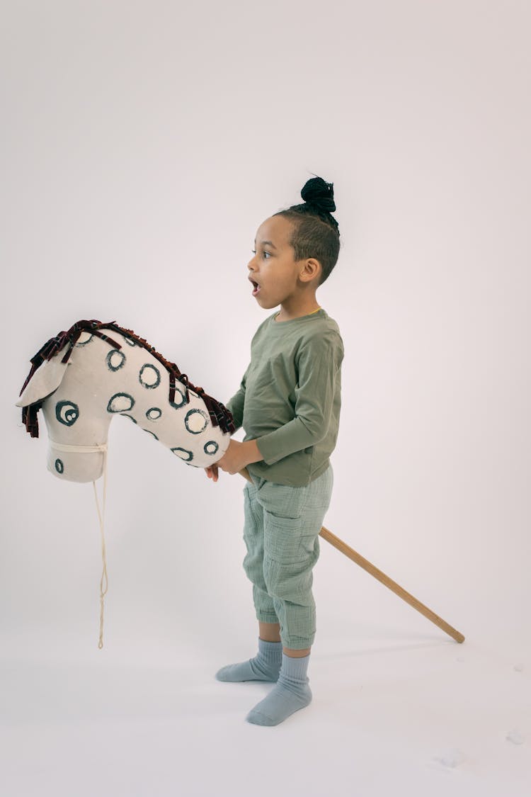 Little Boy Riding Hobby Horse