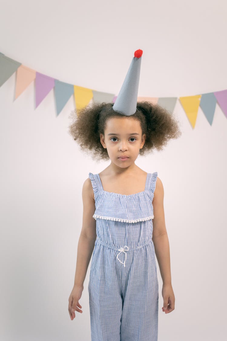 Girl In Cute Outfit With Party Hat