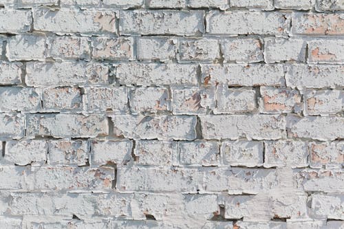Free Background of old brick wall with weathered surface Stock Photo