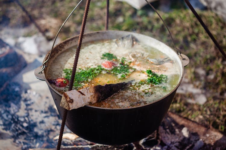 Delicious Fish Soup With Chopped Parsley In Cauldron