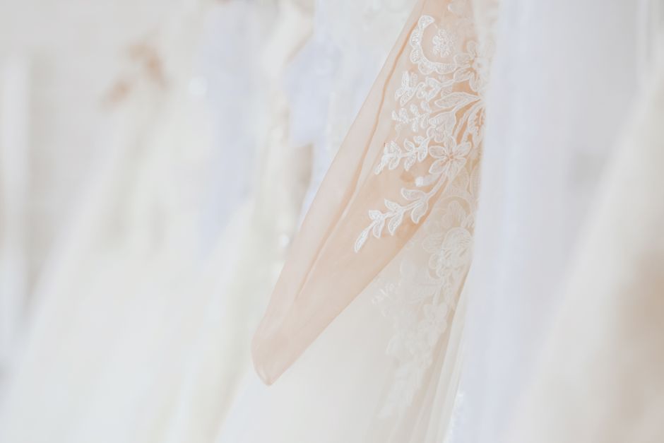 Modern bridal salon showroom with elegant wedding dresses on display Modern bridal salon showroom with elegant wedding dresses on display