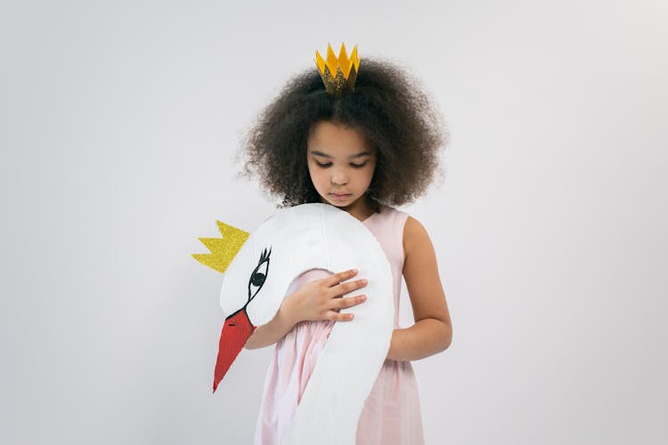 Girl With Crown Holding Paper Bird