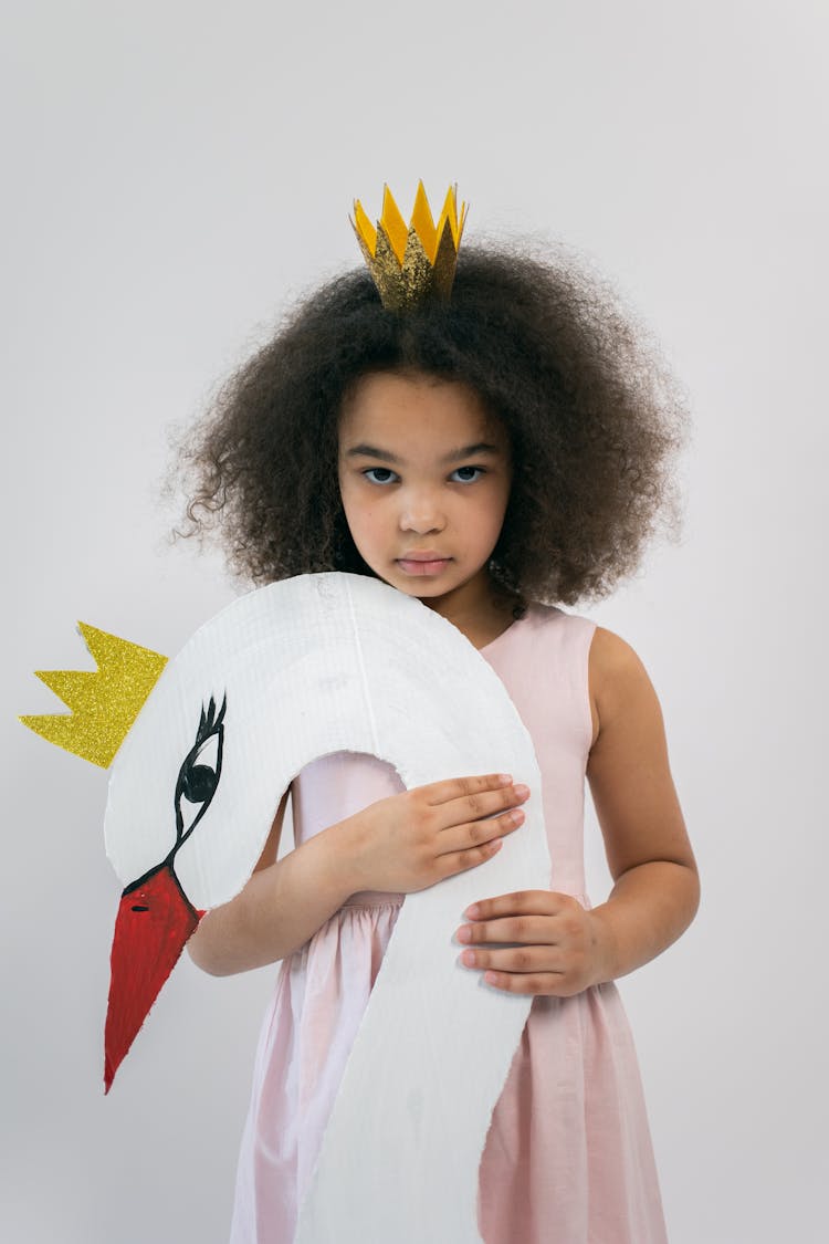 African American Child Holding Cardboard Swan