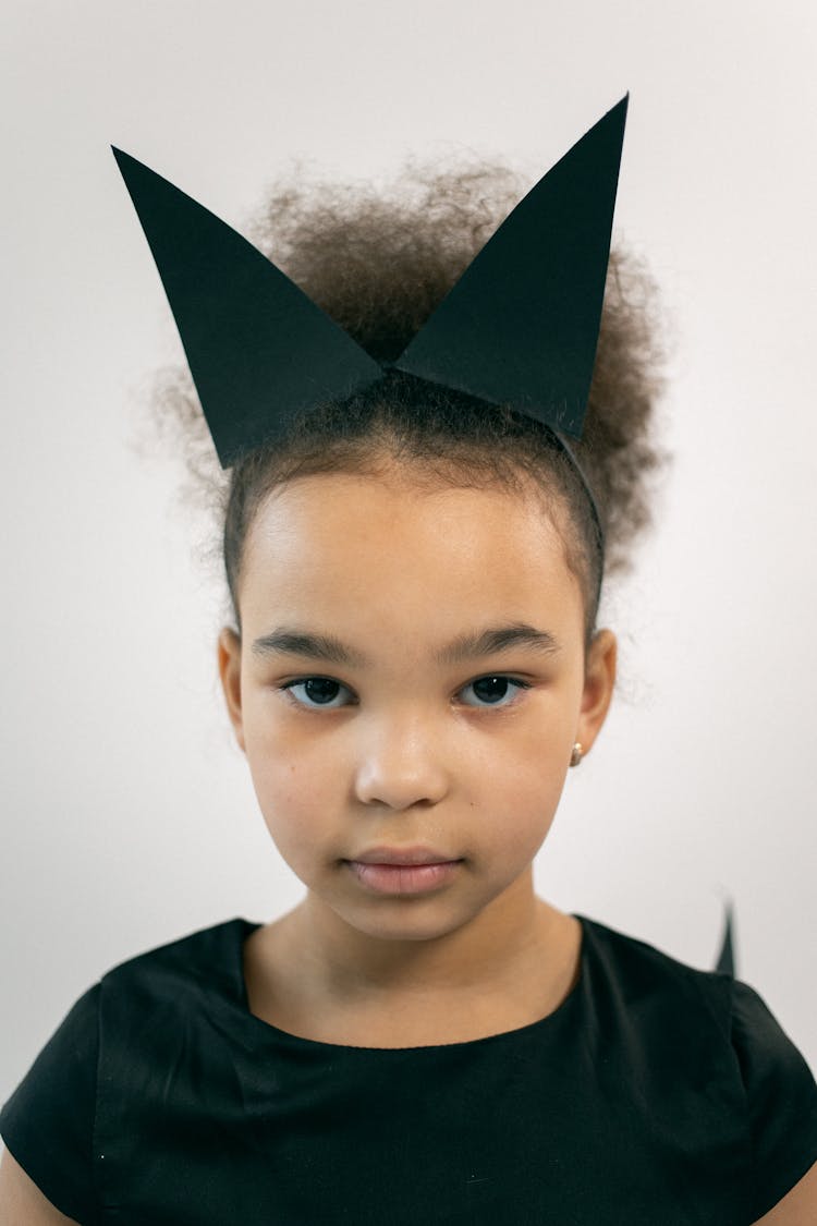 Cute Girl With Afro In Black Costume