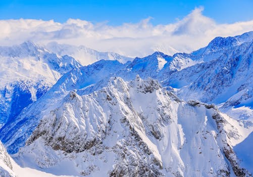 Stunning view of snow-covered peaks in Engelberg, Switzerland. Perfect for winter adventures.