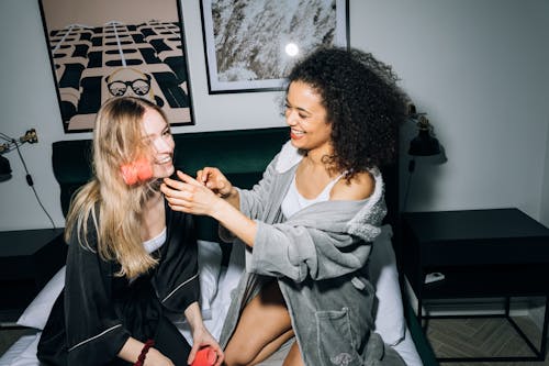 Free Two Young Women Putting Hair Rollers on Their Hair Stock Photo