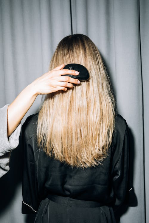 Free Back View of a Person With Blonde Hair Stock Photo