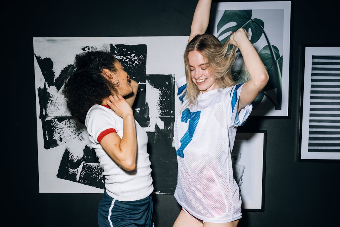 Two Young Women Having Fun Dancing