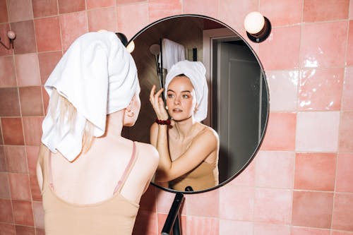 Free Young Woman Doing Her Facial Skin Care Stock Photo
