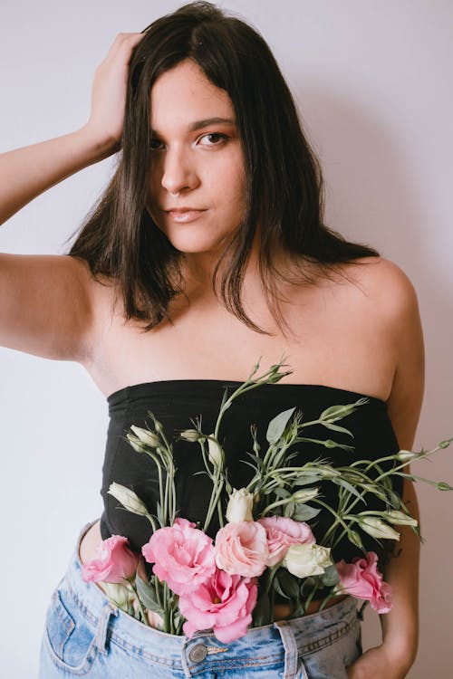 Woman in Black Tube Top with Flowers on her Waist